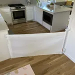 Retractable safety gate