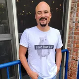 white t-shirt with the phrase 'litty kitty' feature large house cat